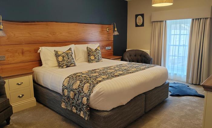 Extra Large super king bed with oak headboard, Room name inspired by the Mabinogion the book of Welsh mythology